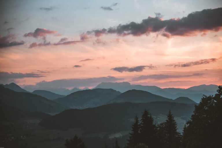 Tranquil view of Brixen im Thale mountains at sunset, capturing serene natural beauty.